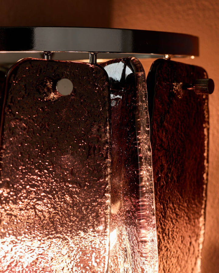 Estelle wall light with smoked ombre glass, close-up detail showing textured amber-tinted glass panels and chrome fixture hardware.