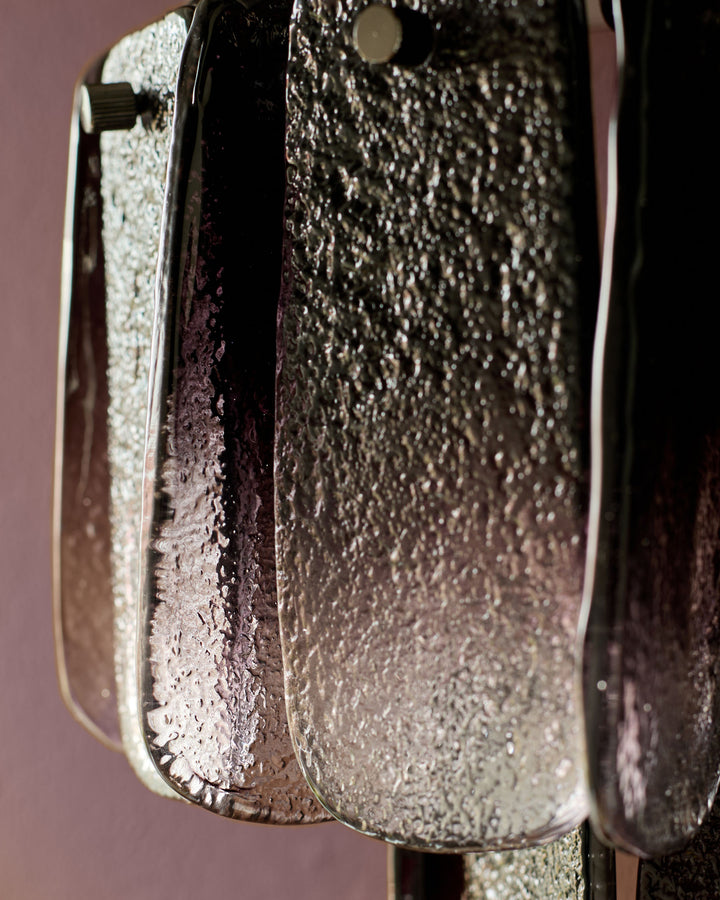 Estelle wall light with smoked ombre glass cylinders, close-up detail showing textured glass finish and metallic hardware.