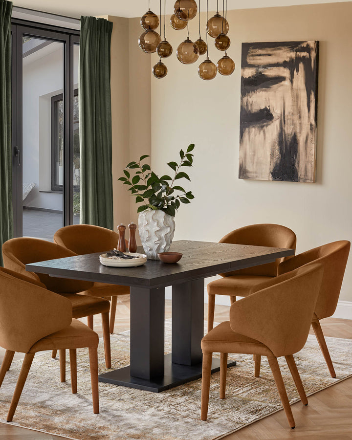 A dining table and chairs are set on a rug. The style is modern and the colour scheme is muted.