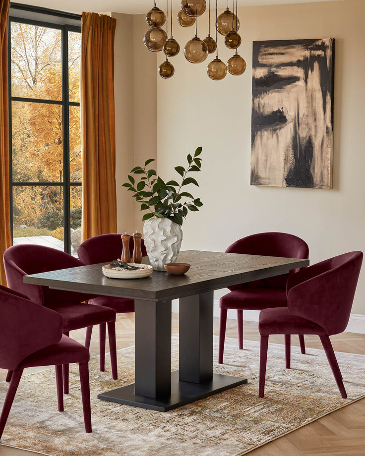 Plum velvet dining chair with curved back and wooden legs, shown in a modern dining room setting.