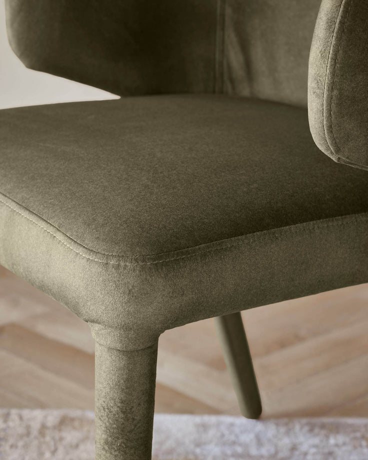 A stylish chair with a textured, earthy-toned fabric and a modern design, perfect for adding comfort and sophistication.