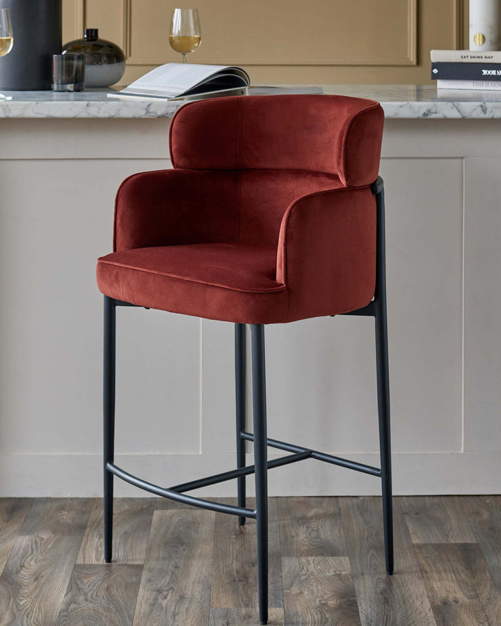 A stylish, high-legged bar stool upholstered in luxurious terracotta velvet with sleek, dark metal frame.