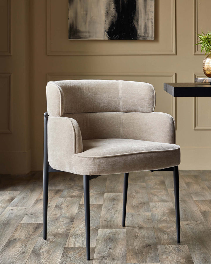 A modern beige upholstered dining chair with black metal legs, adding elegance to your dining space.
