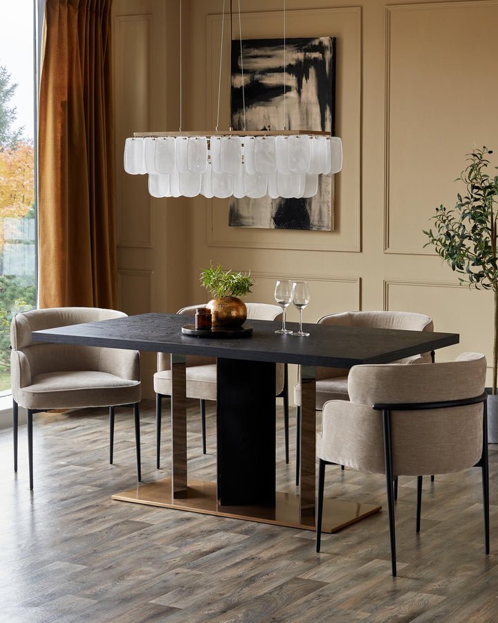 A dining set with a dark wood table, light coloured chairs, and a modern chandelier above.