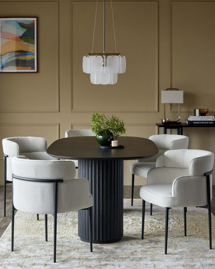 A stylish dining set with a dark wood table, plush chairs, and modern chandelier creates an inviting dining space.