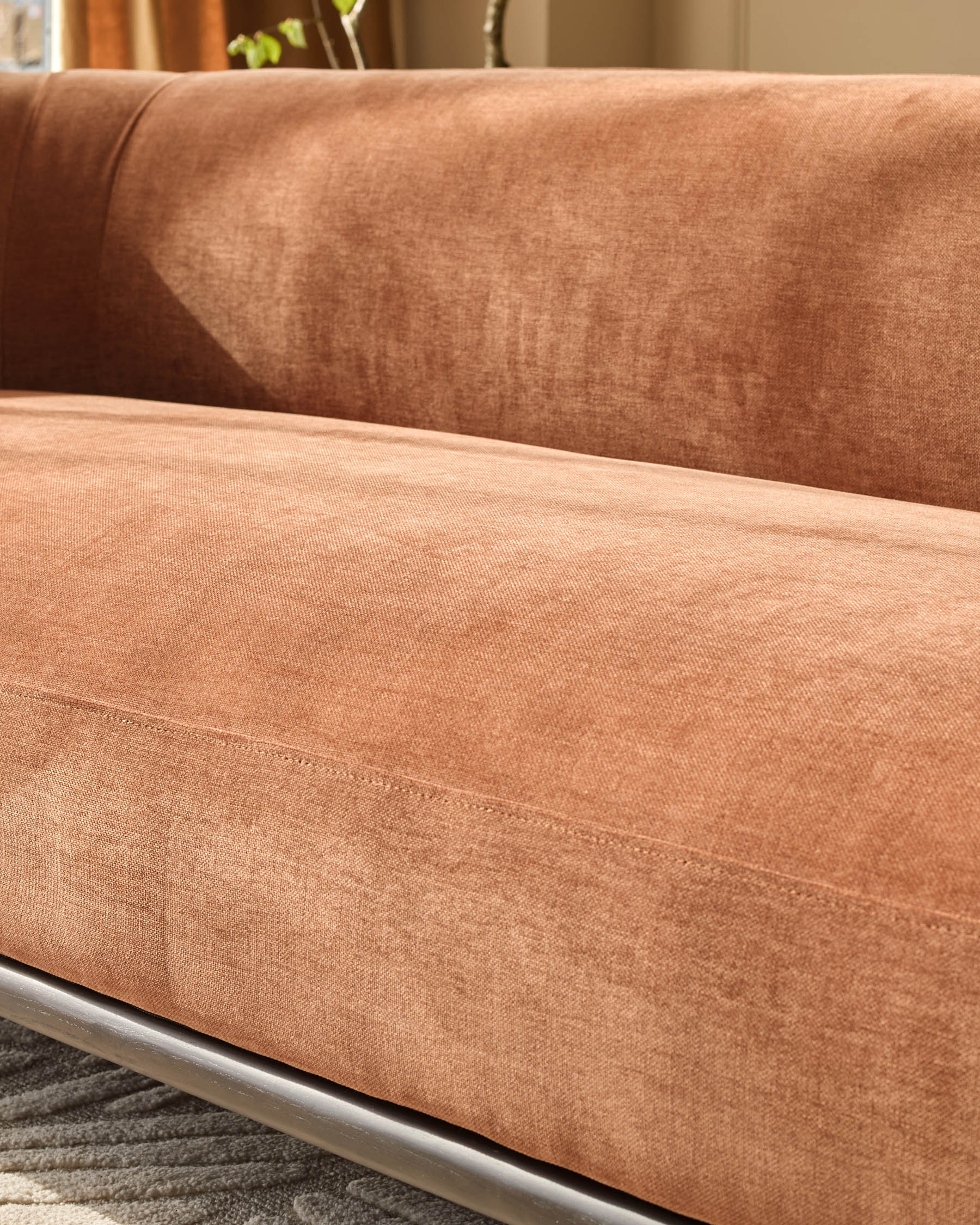 Florence 3-seater sofa in apricot weave fabric, close-up of seat cushion and metal base detail.