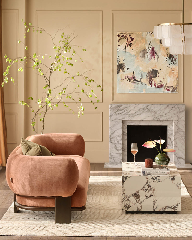 Apricot weave fabric armchair with curved design and dark wood legs, styled in a modern living room setting.