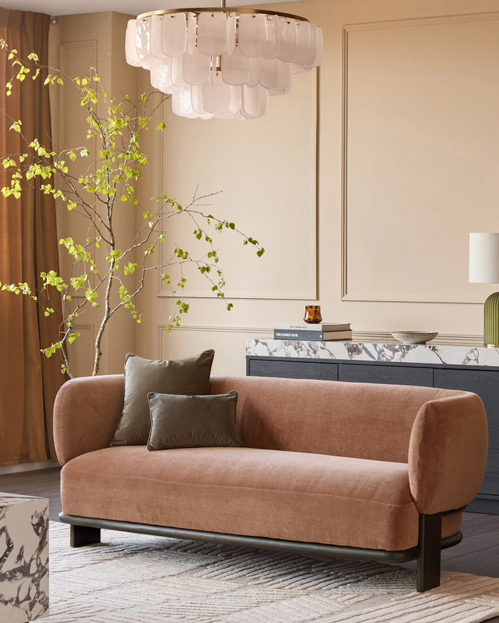 Florence 2-seater sofa in apricot fabric with dark wood base, displayed in a modern living room setting.
