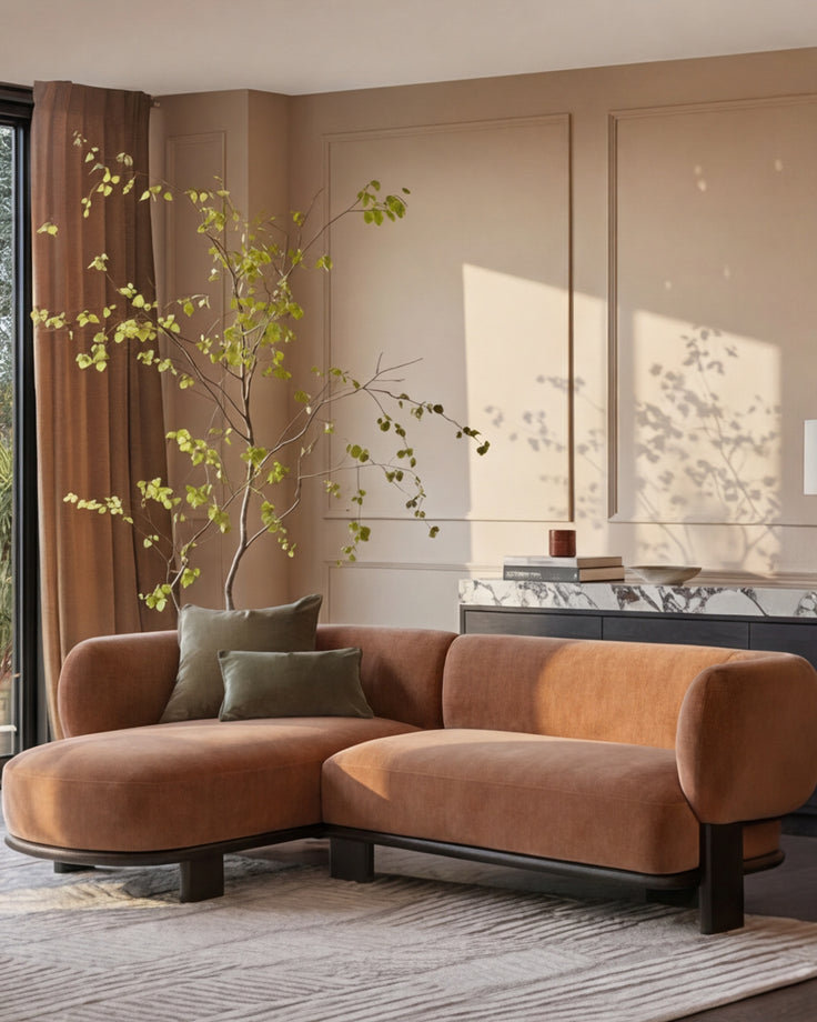 Florence left-hand-facing chaise sofa in apricot fabric with dark wood base, displayed in a beige living room.