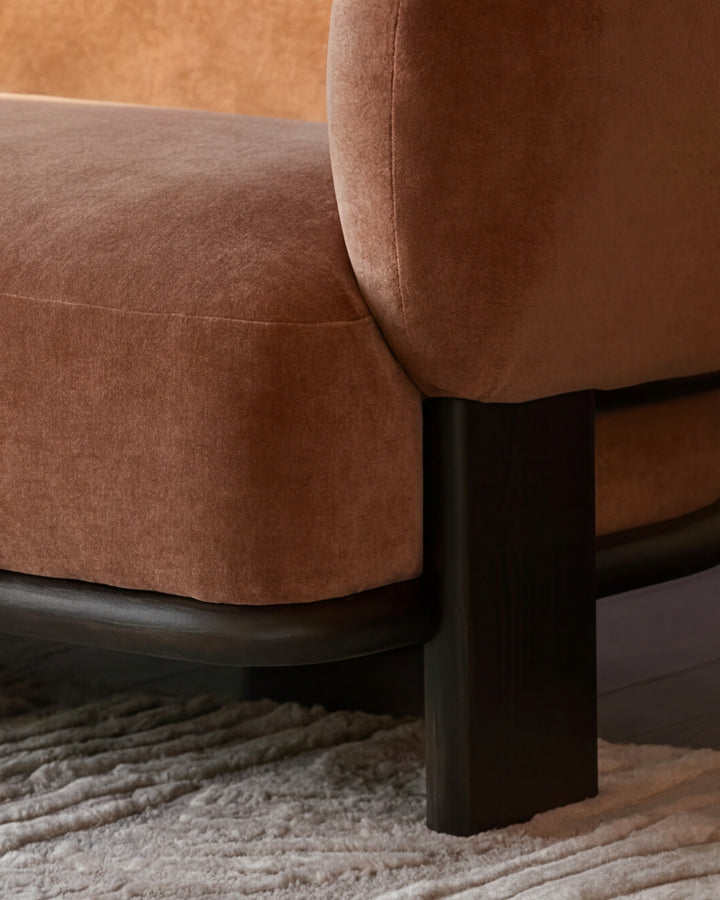 Florence right-hand chaise sofa in apricot fabric with dark wood legs, displayed at an angle on a textured neutral rug.