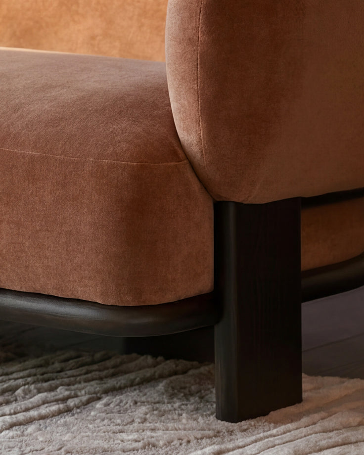 Florence right-hand chaise sofa in apricot fabric with dark wood legs, displayed at an angle on a textured neutral rug.