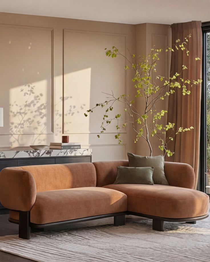 Florence right-hand-facing chaise sofa in apricot fabric with dark wood base, displayed in a modern living room setting.