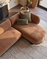 Florence right-hand-facing chaise sofa in apricot fabric with dark wood base, styled with sage green pillows in a modern living room.