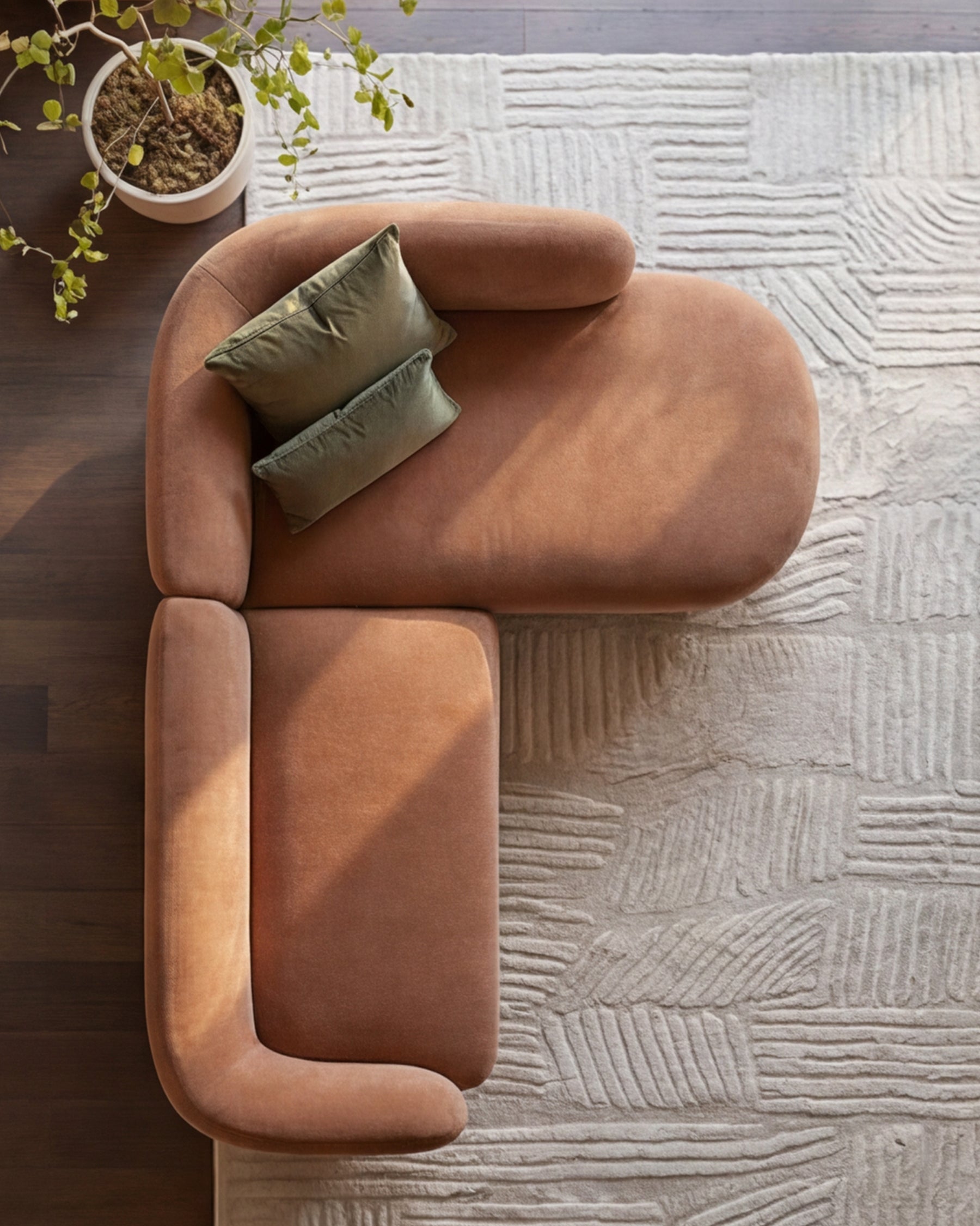 Florence right-hand-facing chaise sofa in apricot fabric with rolled arms, viewed from above on textured rug with accent pillows.
