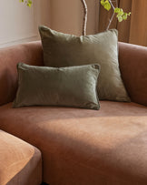 Florence right-hand chaise sofa in apricot fabric with sage green pillows and decorative branch with foliage.