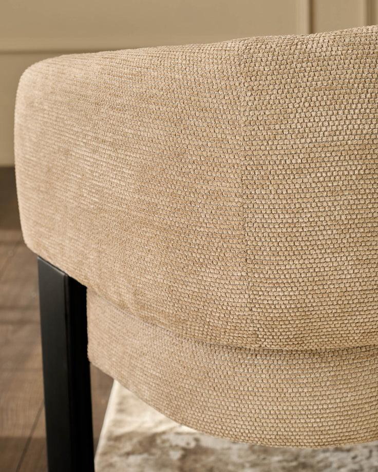 Florence dining chair in honey fabric, close-up of curved backrest showing textured weave and black wooden leg.