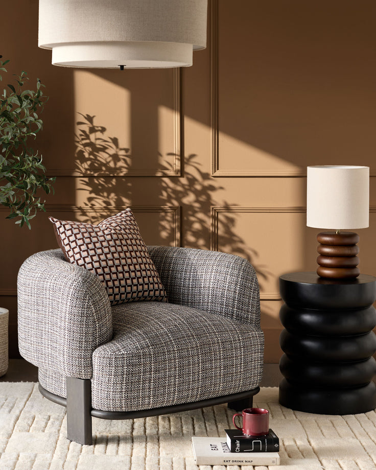 Florence armchair in dark chocolate weave fabric with dark wood frame, styled in a warm-toned room setting.