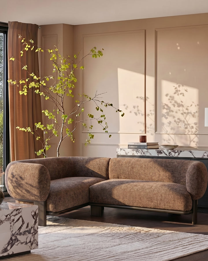 Florence left-hand-facing small corner sofa in mocha fabric with dark wood legs, displayed in a warm minimalist living room.