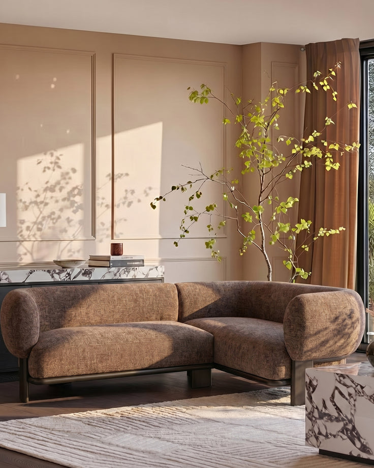 Florence right-hand-facing small corner sofa in mocha fabric with dark wood legs, displayed in a warm, minimalist living room setting.