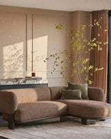 Florence right-hand-facing chaise sofa in mocha fabric with dark wood legs, positioned in a minimalist room setting.