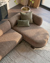 Florence right-hand-facing chaise sofa in mocha fabric with dark wood legs, styled with green pillows in a bright living room.
