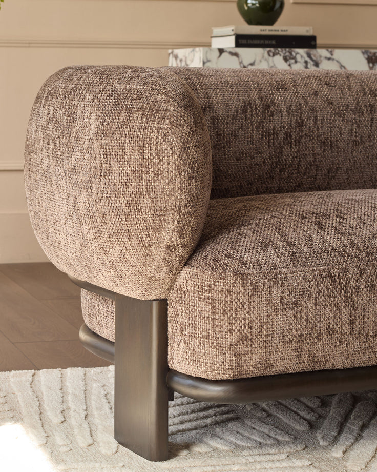 Florence 2-seater sofa in mocha fabric with rounded arms and brushed metal legs, angled side view.
