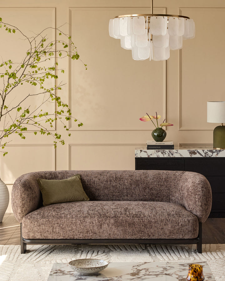 Florence 2-seater sofa in mocha fabric with dark wood frame, curved design, displayed in modern living room setting.
