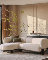 Florence left-hand-facing chaise sofa in natural fabric with dark wood legs, displayed in a modern living room setting.