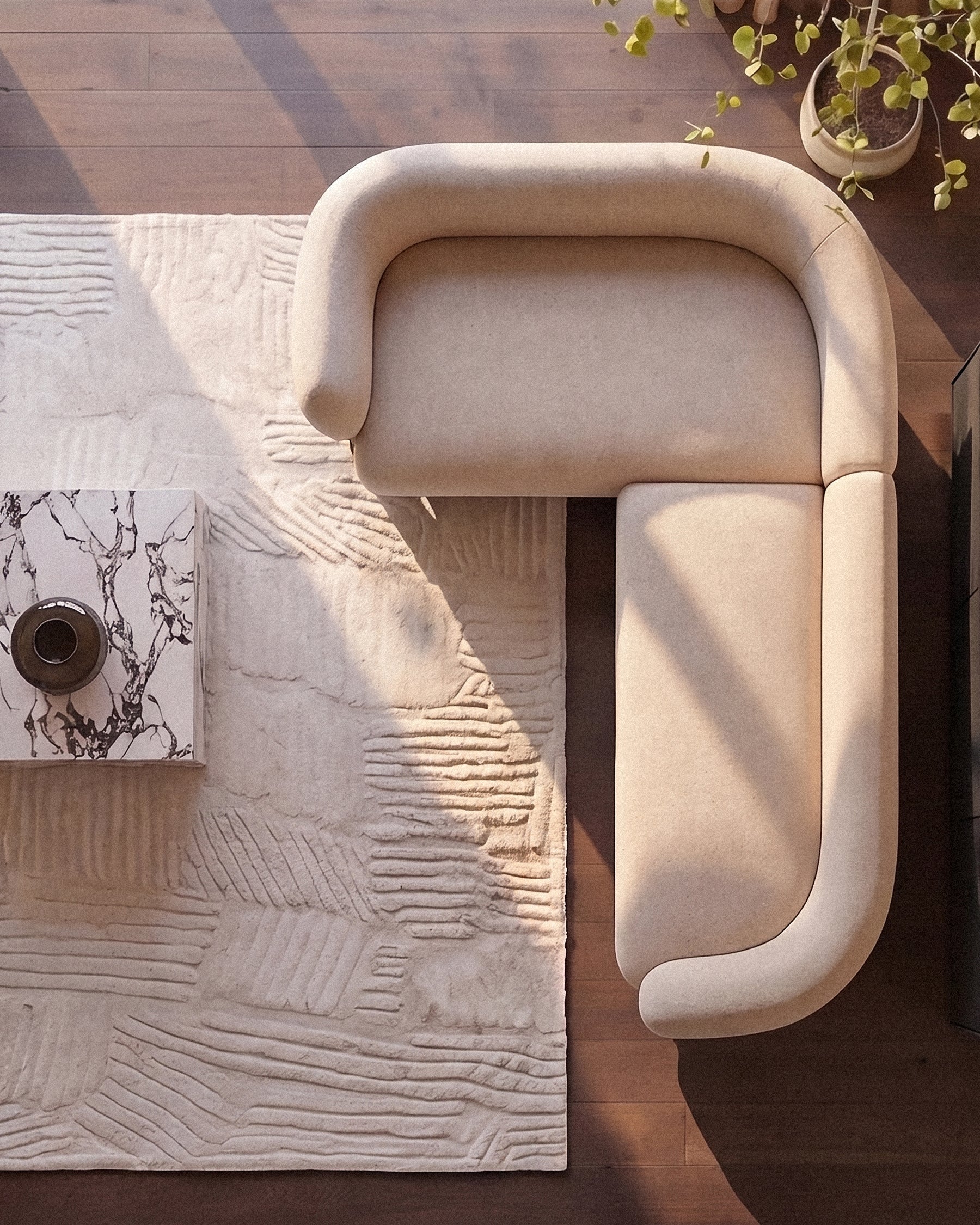 Florence left-hand-facing small corner sofa in natural fabric, viewed from above on wooden floor with plants.