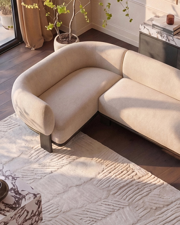 Florence left-hand-facing small corner sofa in natural fabric with dark wood legs, shown in a bright living room setting.