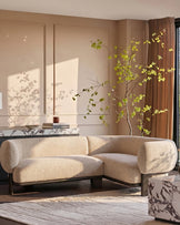 Florence right-hand-facing small corner sofa in natural fabric with dark wood legs, displayed in a modern living room setting.