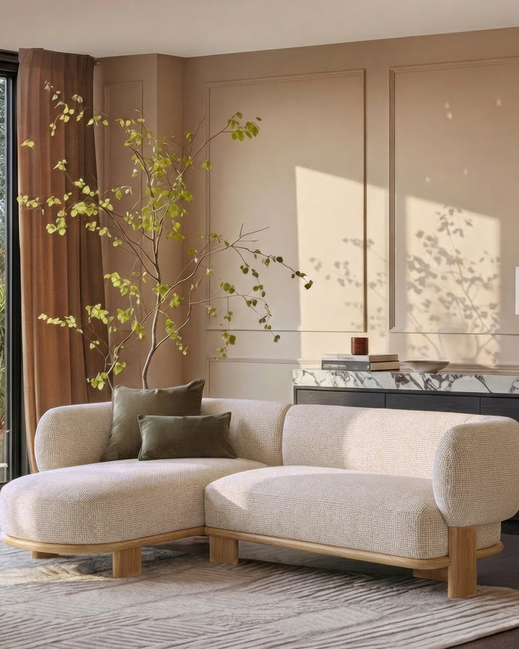 Florence left-hand facing chaise sofa in natural fabric with light wood legs, displayed in a modern living room setting.
