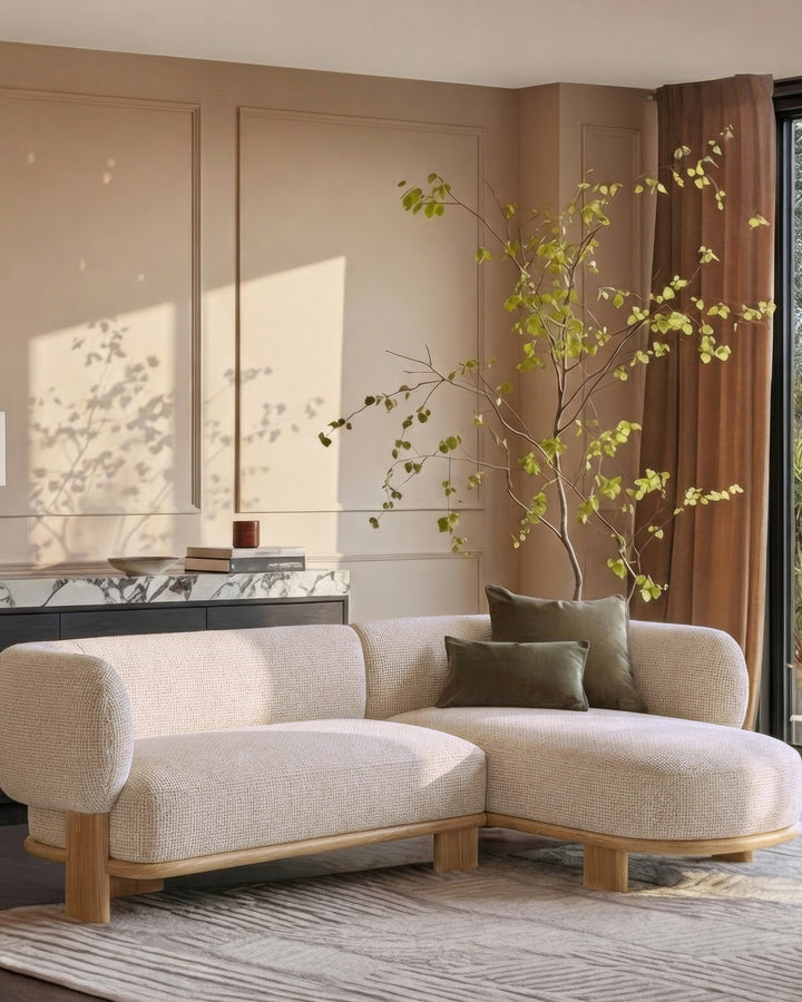Florence right-hand-facing chaise sofa in natural light wood and cream fabric, displayed in a styled living room setting.