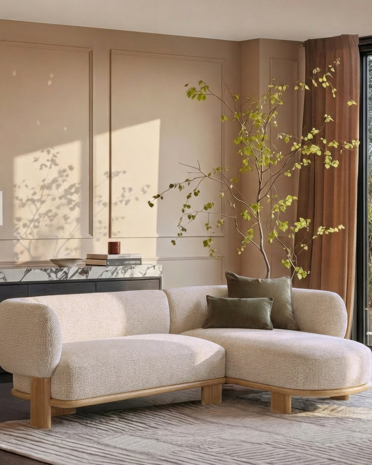 Florence right-hand-facing chaise sofa in natural light wood and cream fabric, displayed in a styled living room setting.