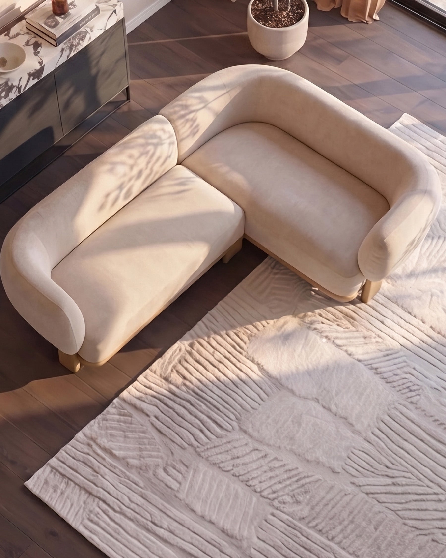 Florence right-hand-facing small corner sofa in natural fabric with light wood legs, shown in bright sunlight.
