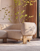 Florence right-hand-facing corner sofa in natural fabric with light wood legs, displayed in a bright living room setting.