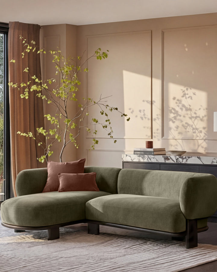 Florence left-hand-facing chaise sofa in olive green fabric with dark wood legs, displayed in a modern living room setting.