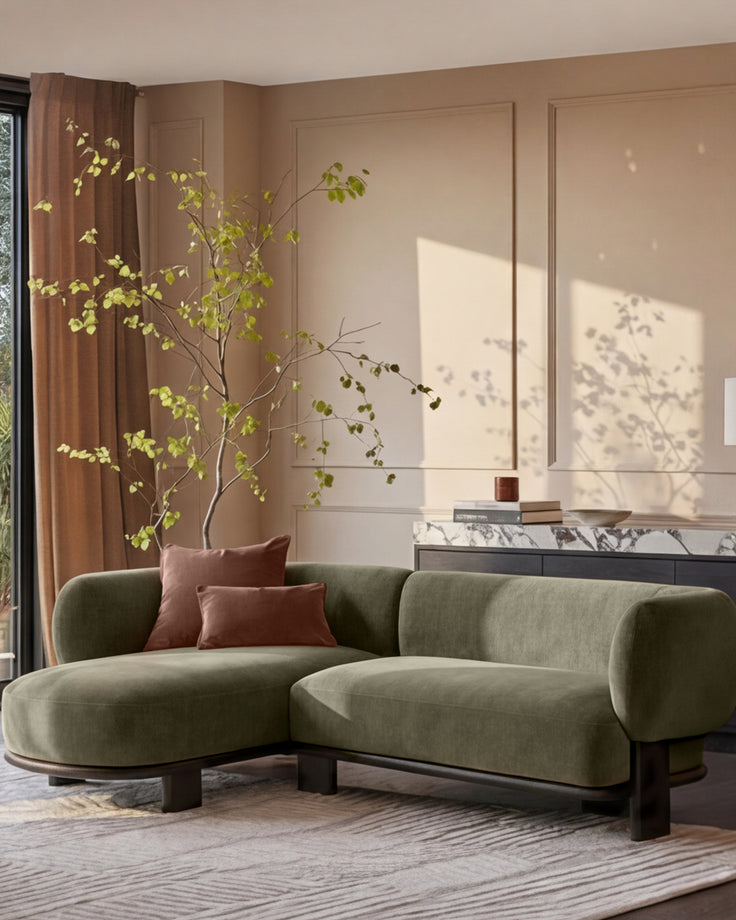 Florence left-hand-facing chaise sofa in olive green fabric with dark wood legs, displayed in a modern living room setting.