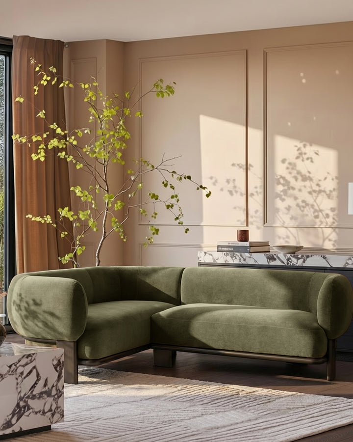 Florence left-hand-facing small corner sofa in dark wood with olive-green fabric, styled in a modern living room.