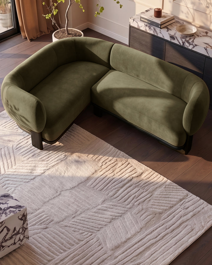 Florence left-hand-facing small corner sofa in dark wood and olive-green fabric, displayed in modern living room setting.