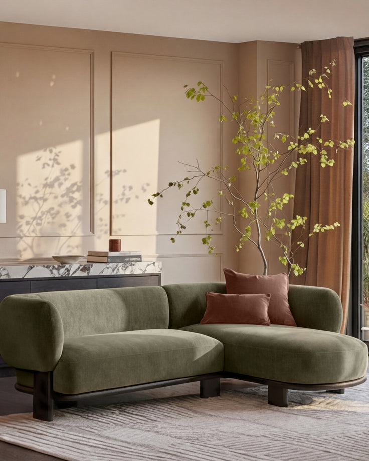 Florence right-hand-facing chaise sofa in olive green fabric with dark wood legs, displayed in a modern living room setting.