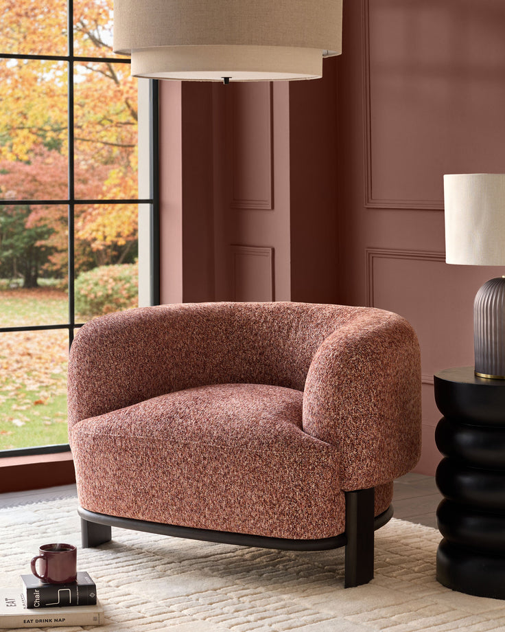 Florence armchair in toffee-red weave fabric with dark wood base, displayed in a styled interior setting.