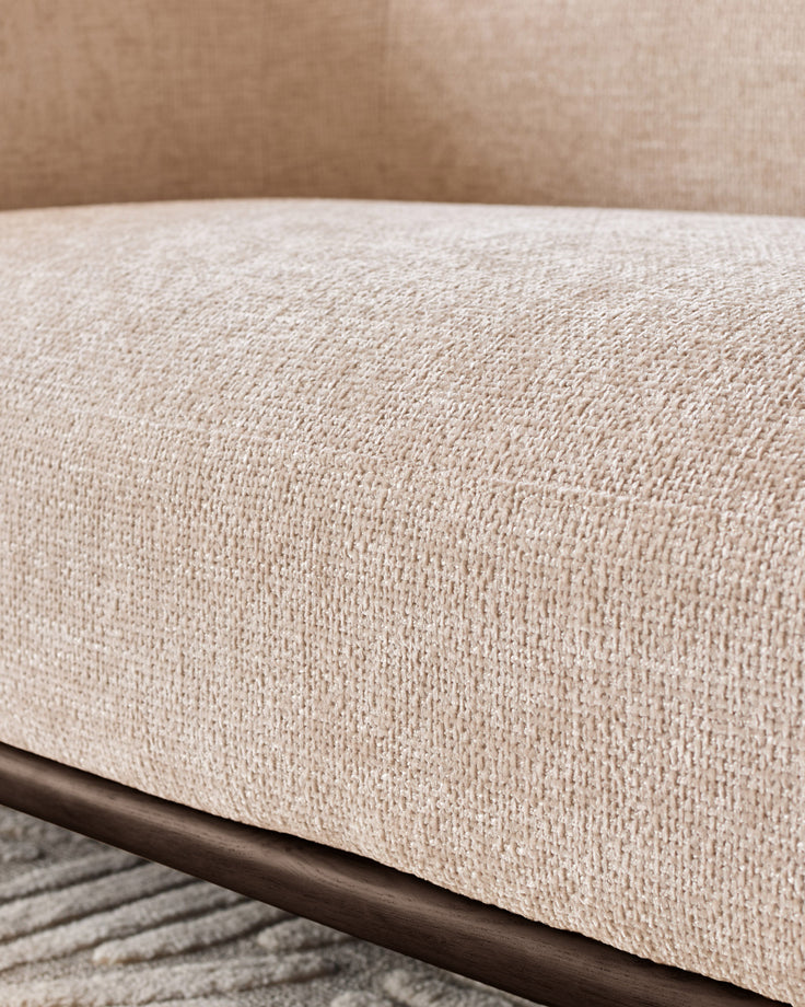Close-up of Florence 2-seater sofa showing natural fabric texture with dark wood frame detail.