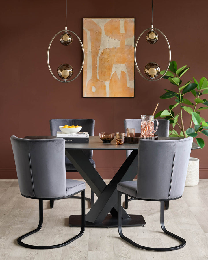 A modern dining set, featuring grey velvet chairs and a dark table, lit by stylish pendant lights.
