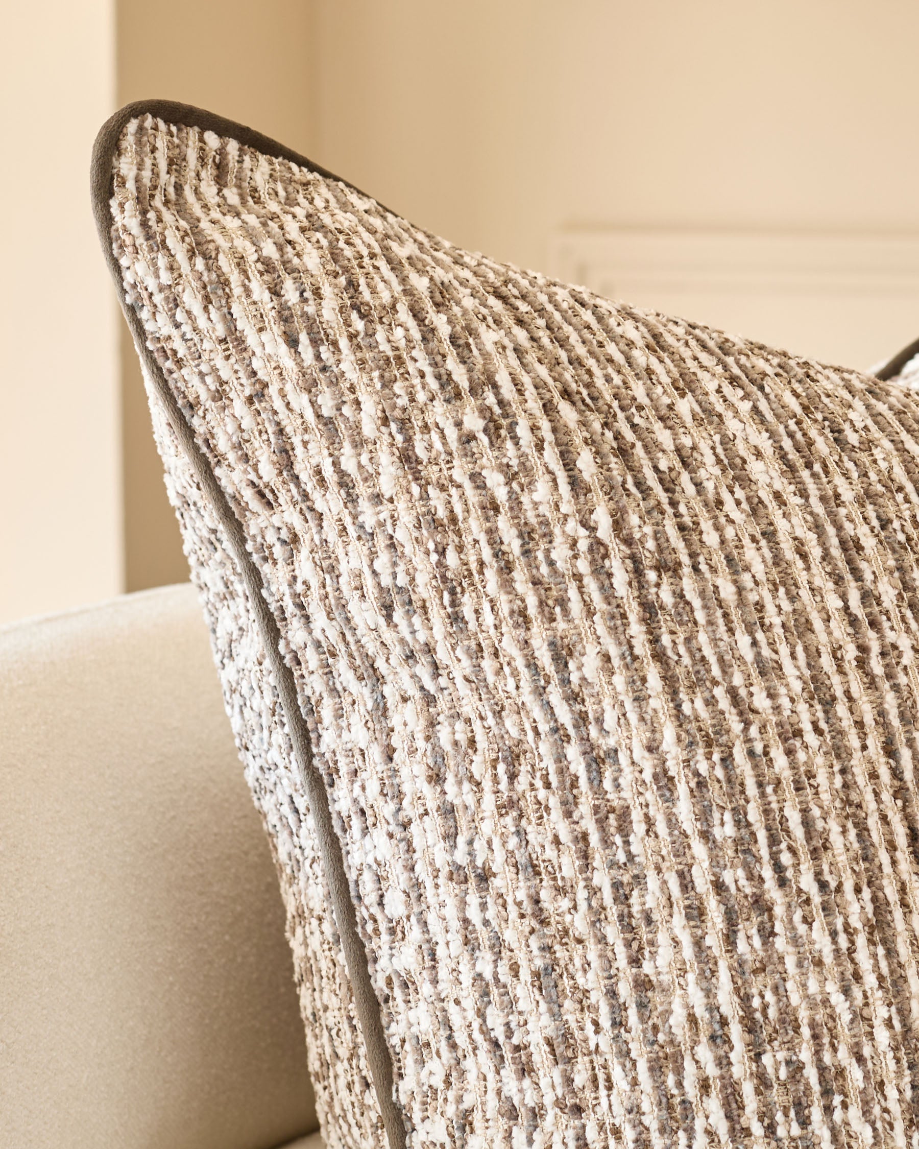 Franco large cushion in chocolate brown textured weave, displayed at an angle showing its ribbed surface detail.