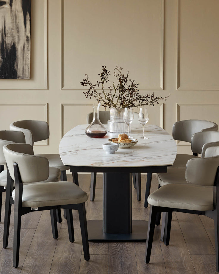 A dining table with a marble top and six upholstered chairs create an elegant dining space.