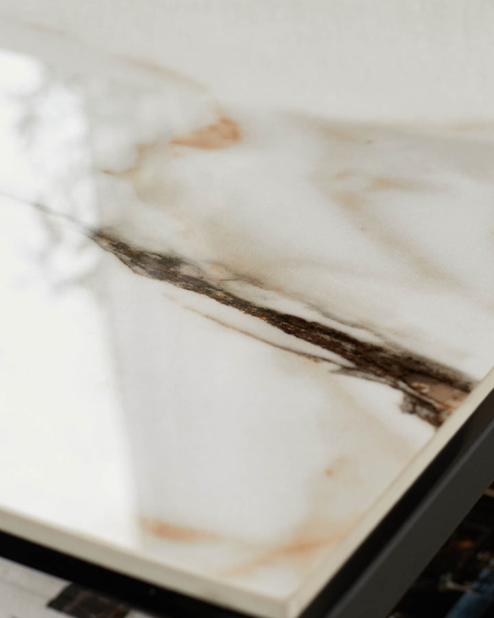 Close up on marble top furniture with dark frame. Modern and stylish design for the home.