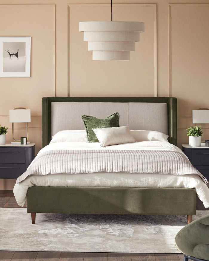 Bedroom featuring a bed with a green velvet frame, light coloured linen headboard, and matching side tables.