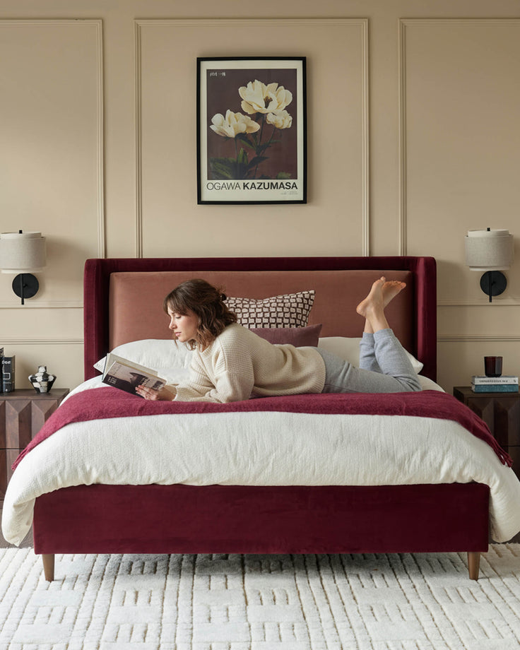 Grove King Ottoman Bed in rose velvet with plum upholstery, styled in a bedroom setting with matching bedding and décor.