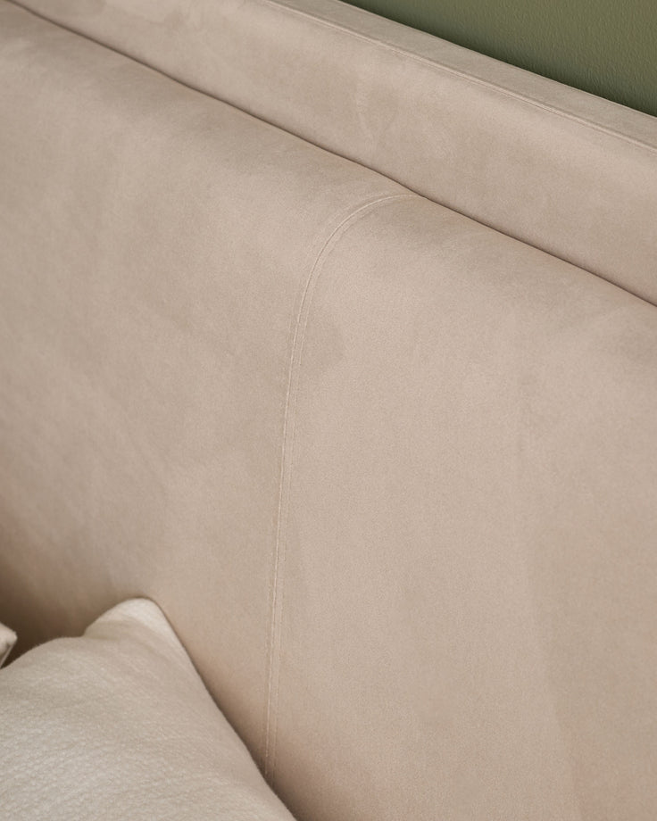 Close-up of champagne velvet upholstery on Grove King Ottoman Bed, showing soft texture and seam detail.
